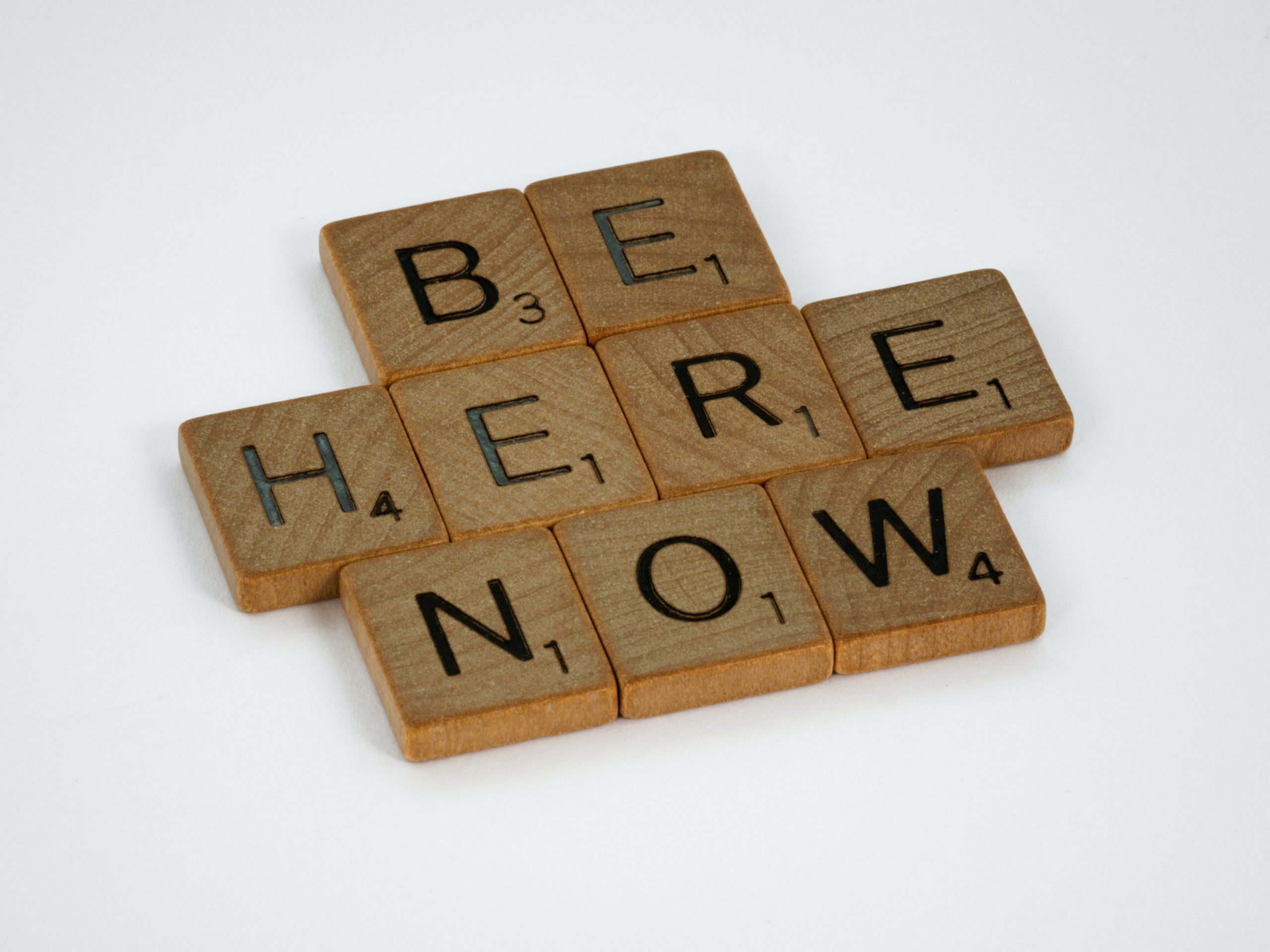 "BE HERE NOW" on tiles